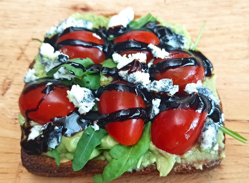 Avocado Toast Home made bread with guacamole and goat cheese, cherry tomate and arugula/rocket or tomate and fresh basil