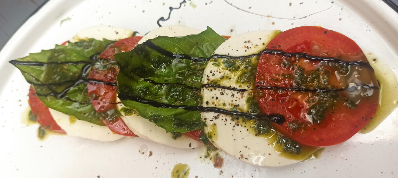 Caprese Salad Fresh mozzarella, tomatoe, basil and balsamic vinegar cream